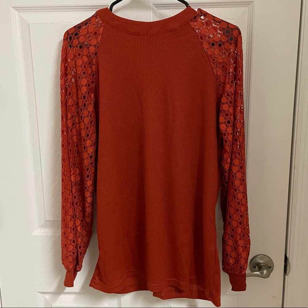 Burnt orange solid body with cutout circle sleeves